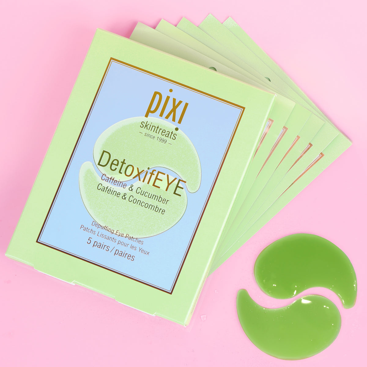 A 5-pack stack of Pixi Skintreats DetoxiEYE eye gel patches in a light green box, displayed on a pink background with two green gel patches placed in front.